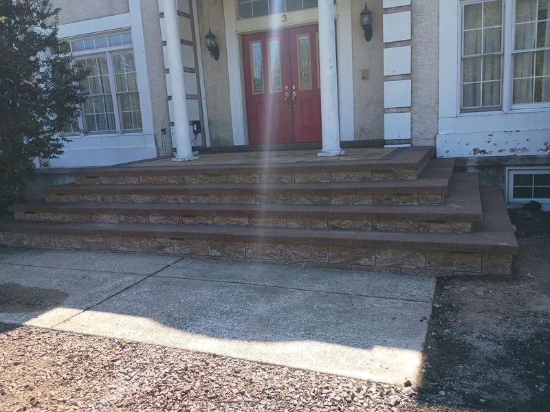 Stone veneer steps with brown caps, finished in daylight